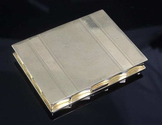 A mid 20th century American Volupte 14ct gold rectangular compact, gross 144.8 grams.